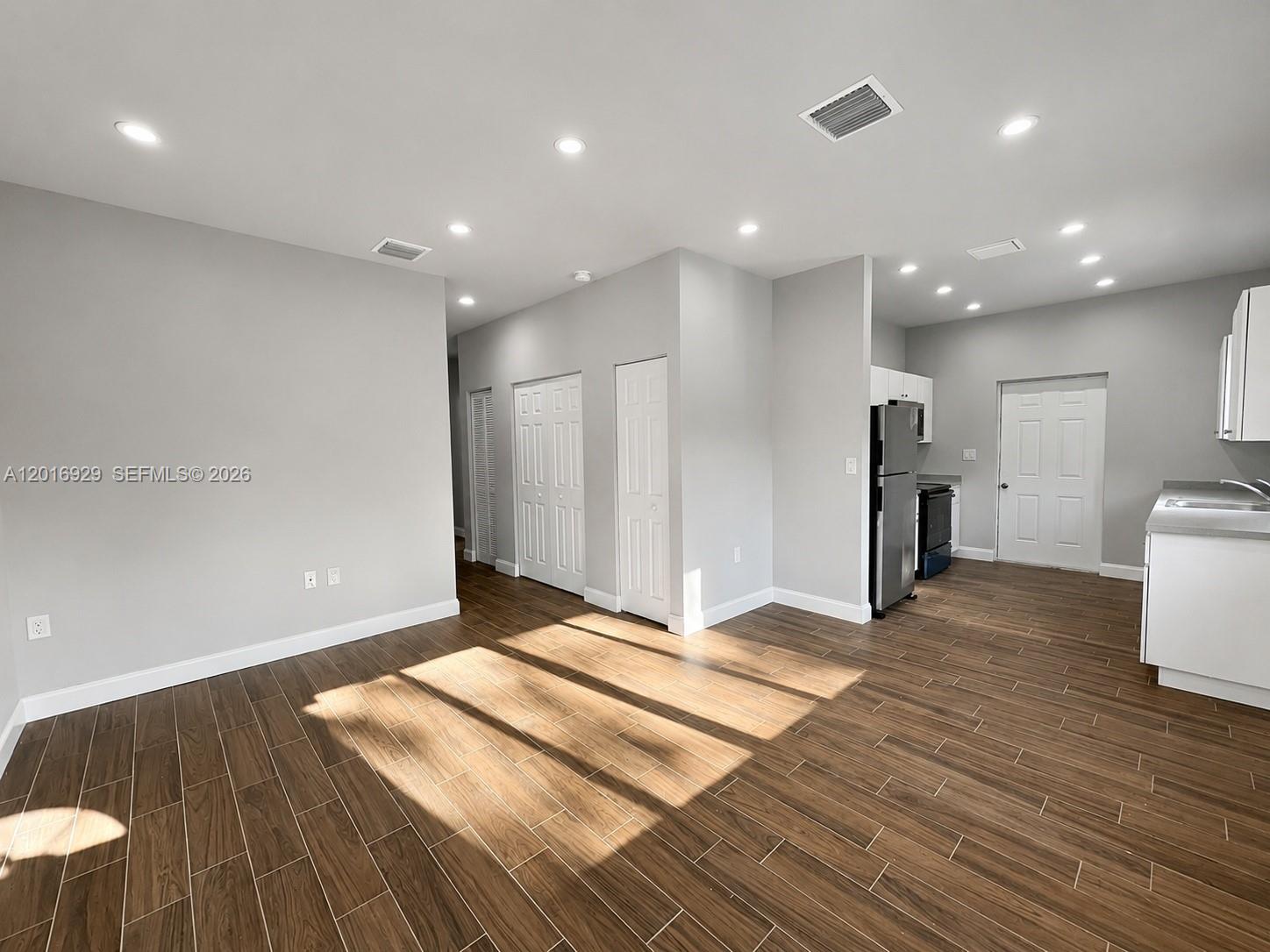 4721 Northwest 15th Court, Unit 1 Miami, FL 33142 - Photo 3 of 11 a view of an empty room with closet and a window