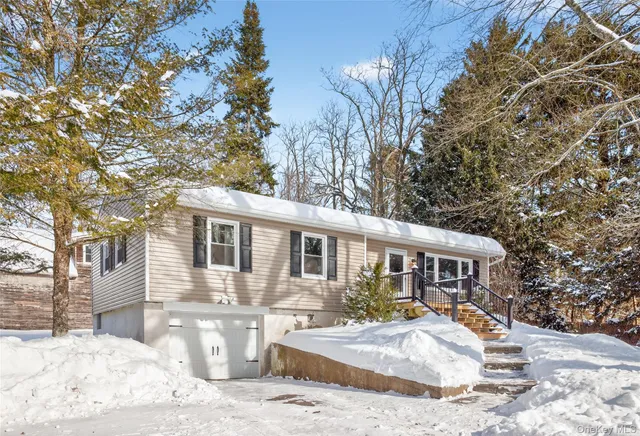 a front view of a house with yard patio and seating space