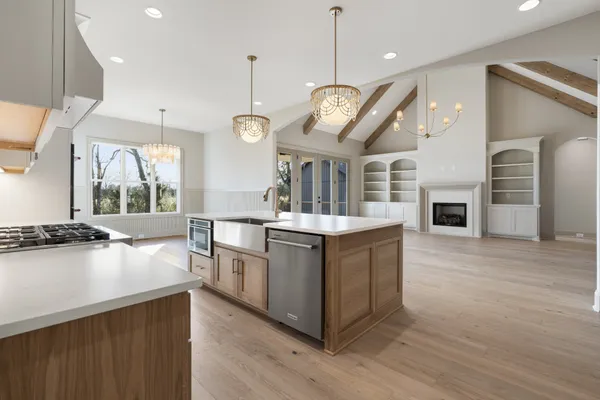 a bathroom with a double vanity sink a mirror and a shower