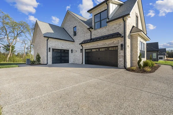 a view of a hallway view with wooden floor and staircase