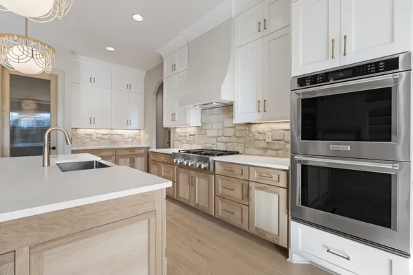 a white bath tub sitting next to a bathroom