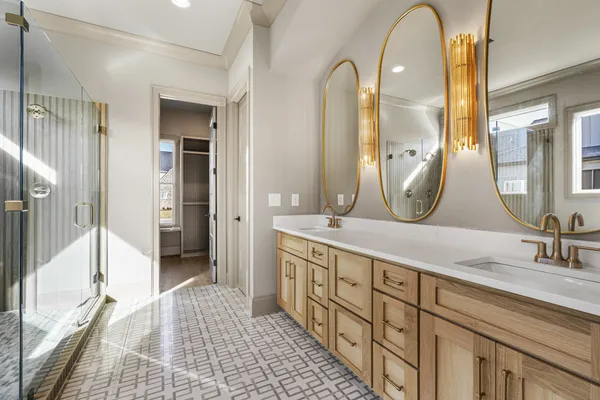 an empty room with windows and ceiling fan