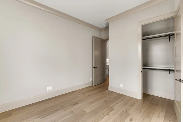 a view of a porch with furniture and floor to ceiling window