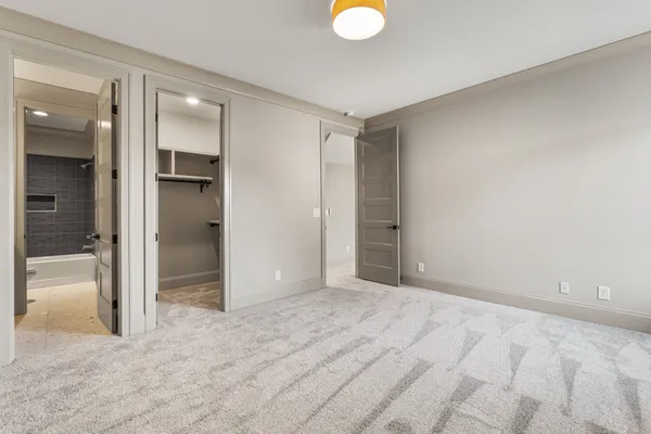 a view of a white house with a big yard and large trees