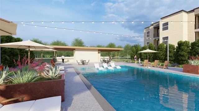 a view of a swimming pool with a patio