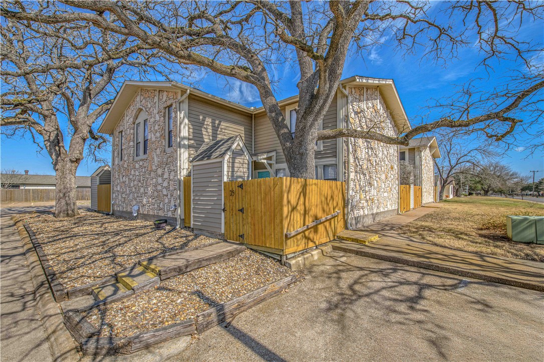 a view of a house with a snow in the yard