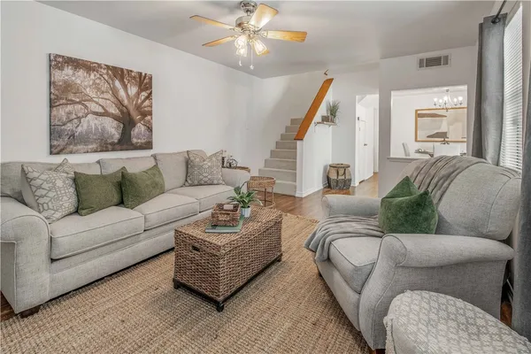 a living room with furniture and a large window