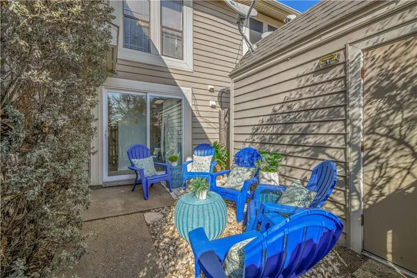 a view of two chairs in the balcony