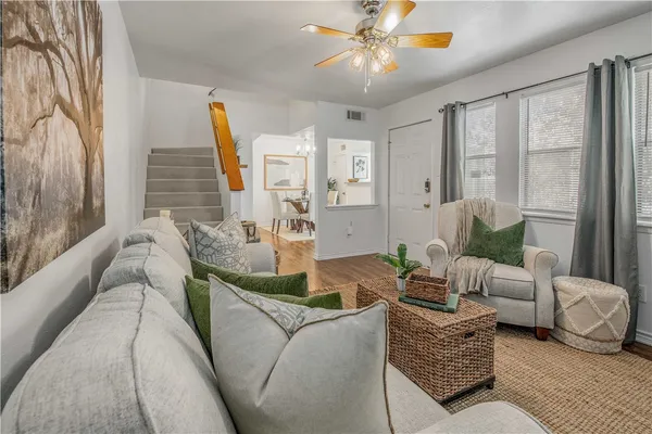a living room with furniture and a large window