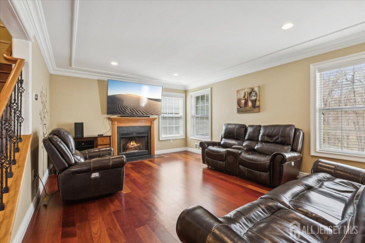 34 Crescent Road Old Bridge, NJ 08857 - Photo 10 of 34 a living room with furniture fireplace and a flat screen tv