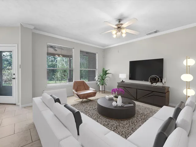 a living room with furniture and a large window