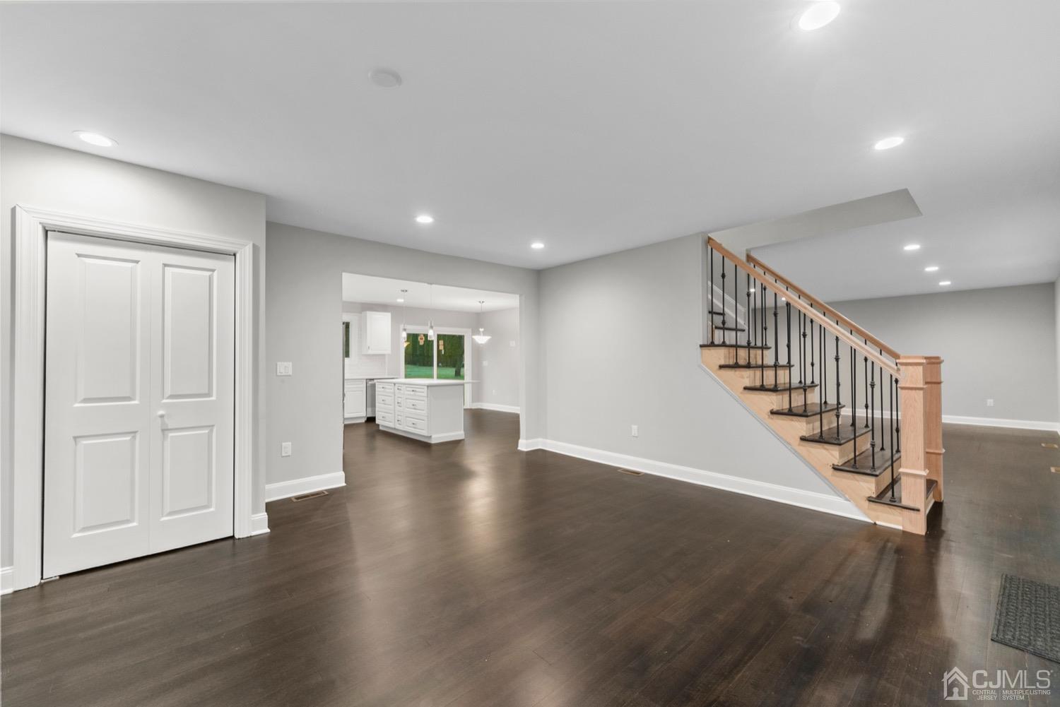 20 Old Ridge Road Monmouth Junction, NJ 08852 - Photo 7 of 26 a view of a hallway with wooden floor windows and stairs