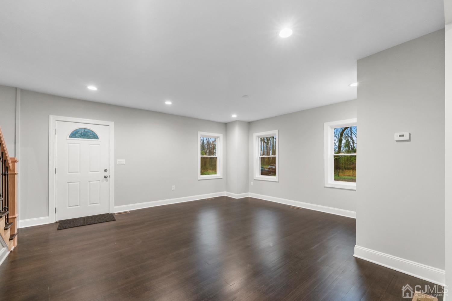 20 Old Ridge Road Monmouth Junction, NJ 08852 - Photo 8 of 26 an empty room with wooden floor and windows