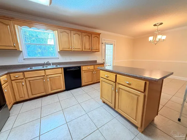 a kitchen with cabinets and appliances
