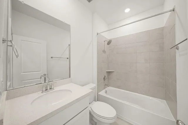 a bathroom with a sink a toilet and a bathtub
