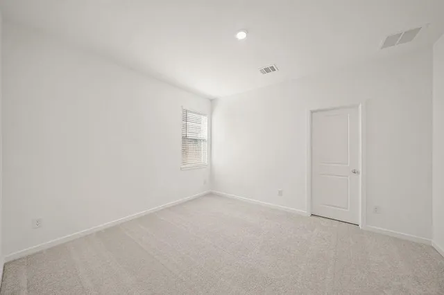 an empty room with a empty space and window