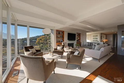 a view of a dining room with furniture window and outside view