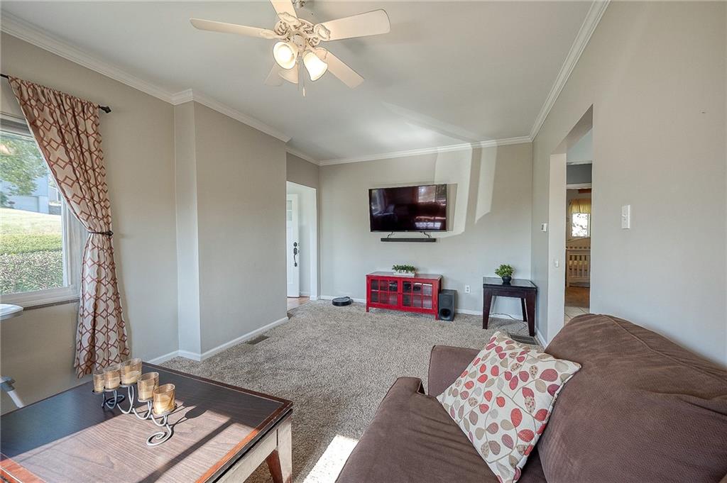 31 Diebold Road McKees Rocks, PA 15136 - Photo 21 of 25 a bedroom with furniture and a flat screen tv