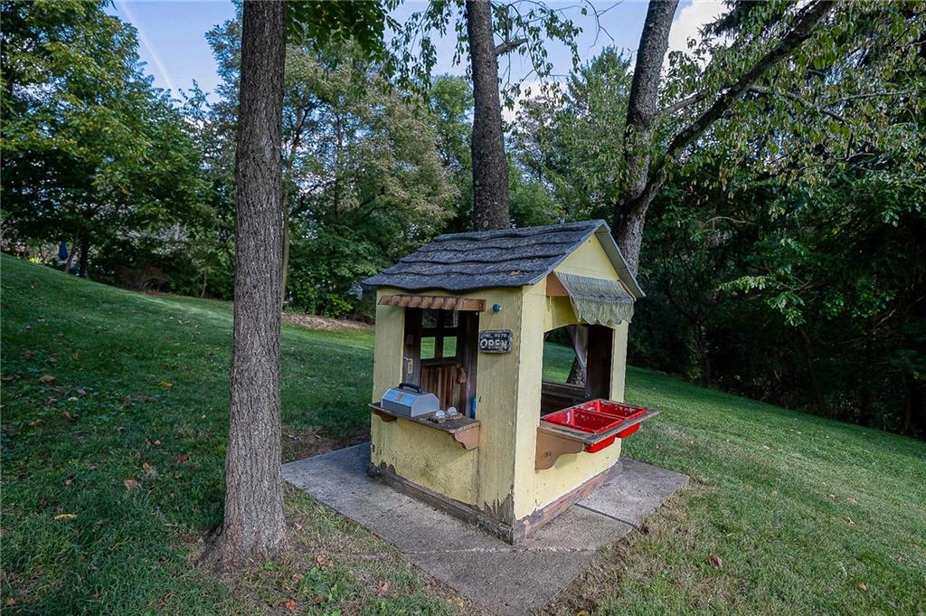 31 Diebold Road McKees Rocks, PA 15136 - Photo 6 of 25 a backyard of a house with barbeque oven and garden