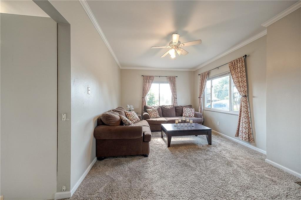31 Diebold Road McKees Rocks, PA 15136 - Photo 8 of 25 a living room with furniture and a chandelier