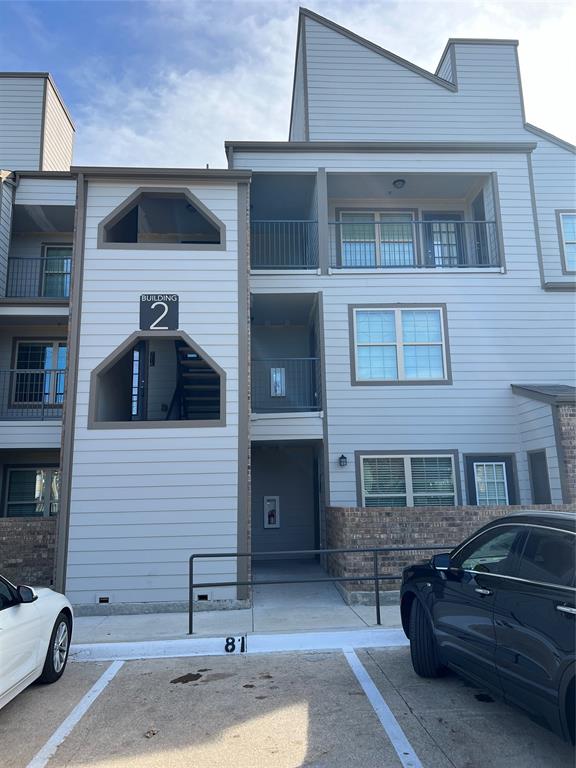 6108 Abrams Road, Unit 225 Dallas, TX 75231 - Photo 12 of 15 a front view of a house with parking space
