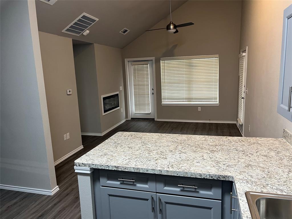 6108 Abrams Road, Unit 225 Dallas, TX 75231 - Photo 2 of 15 a living room with granite countertop furniture and a fireplace