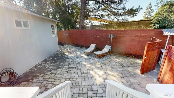 a view of a backyard with sitting area