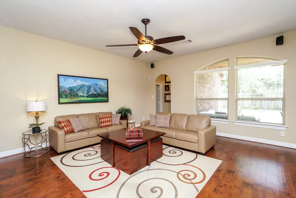 a living room with furniture and a window