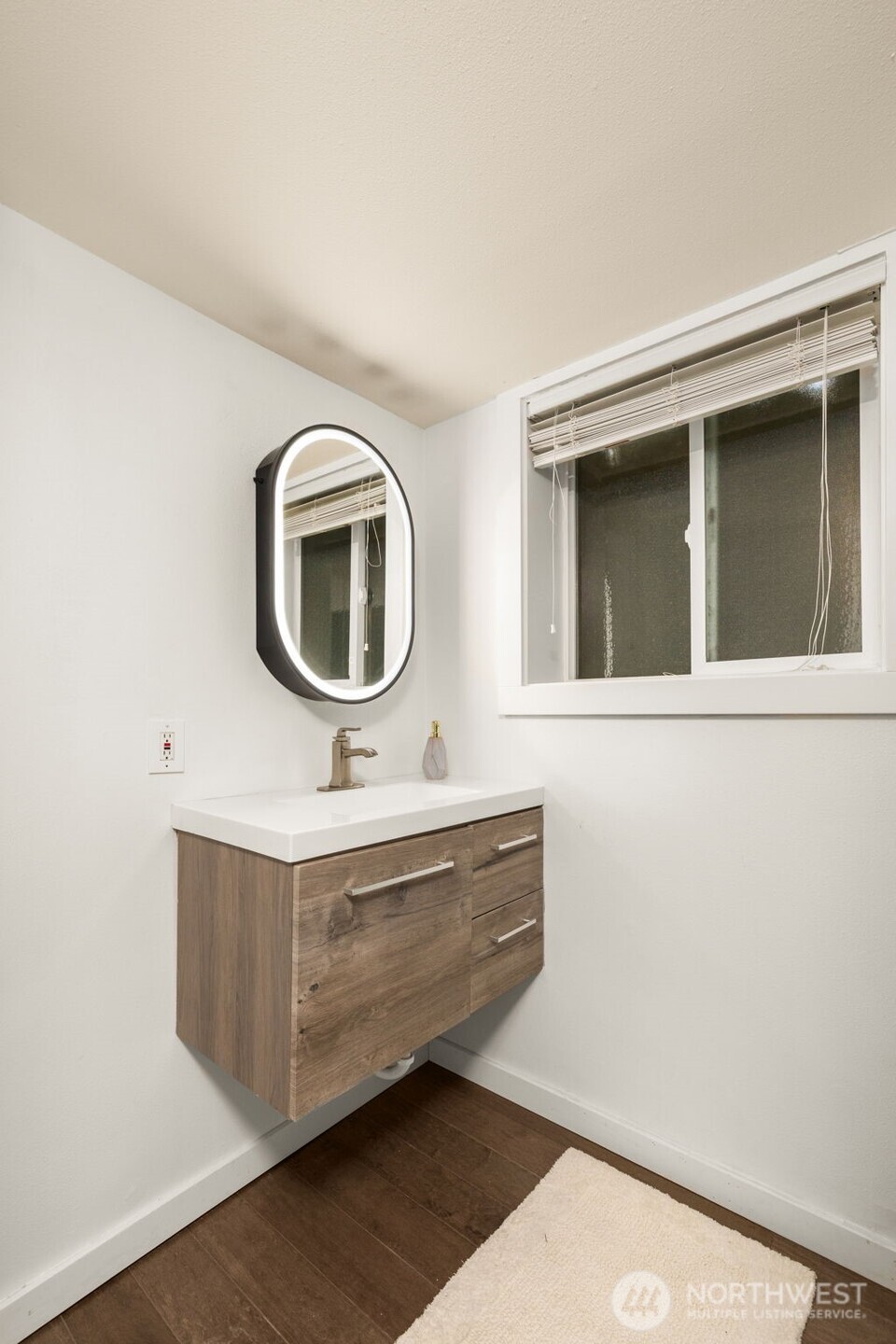 9417 235th Place Southwest Edmonds, WA 98020 - Photo 22 of 30 a bathroom with a sink and a mirror