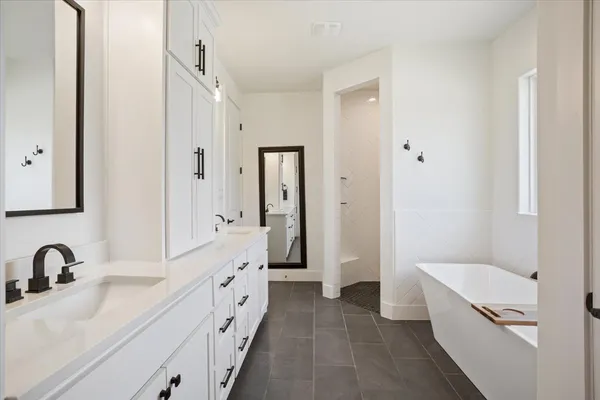 a bathroom with a sink a mirror and a shower