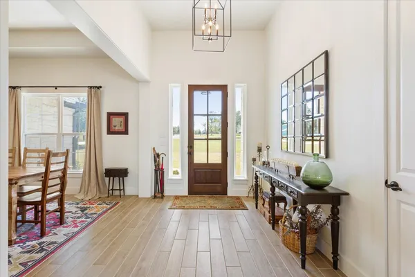 a bedroom with furniture window and wooden floor