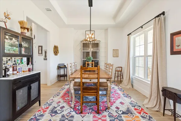 a living room with furniture and next to a window