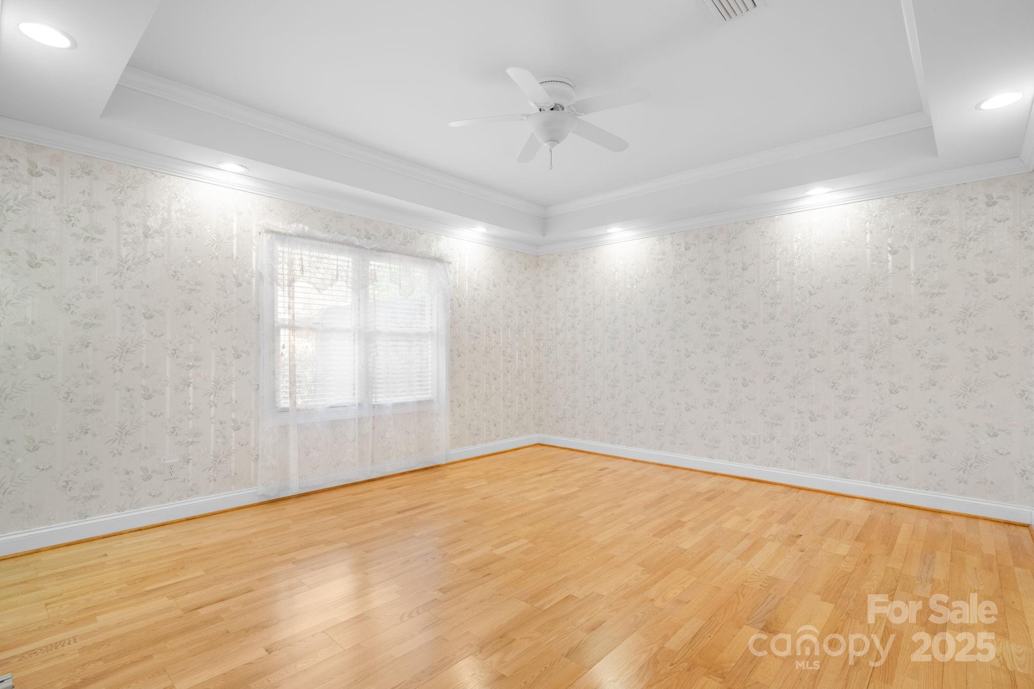 906 3rd St Drive Northeast Conover, NC 28613 - Photo 11 of 47 wooden floor in an empty room with a window