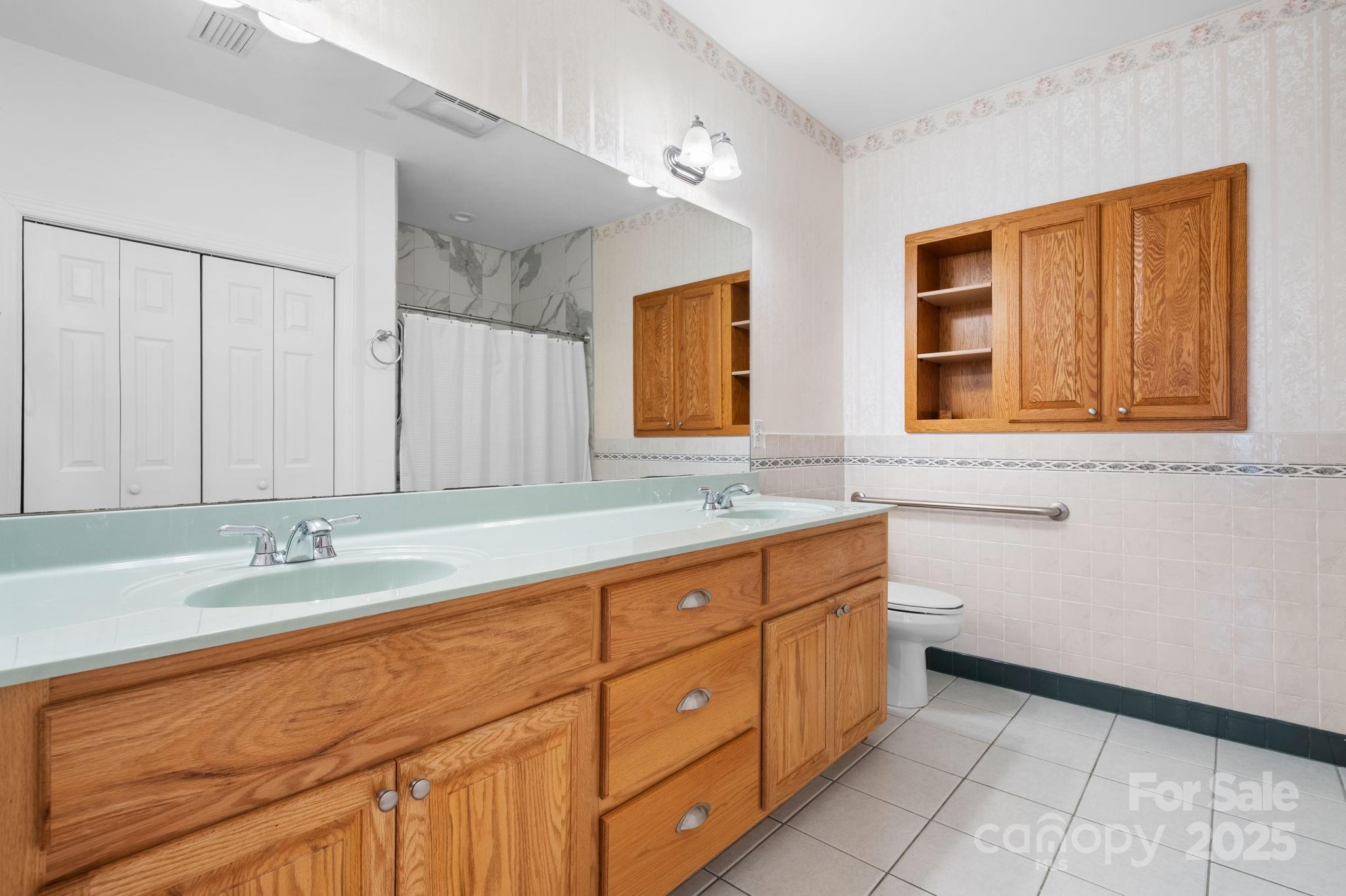 906 3rd St Drive Northeast Conover, NC 28613 - Photo 14 of 47 a bathroom with double sink and a mirror