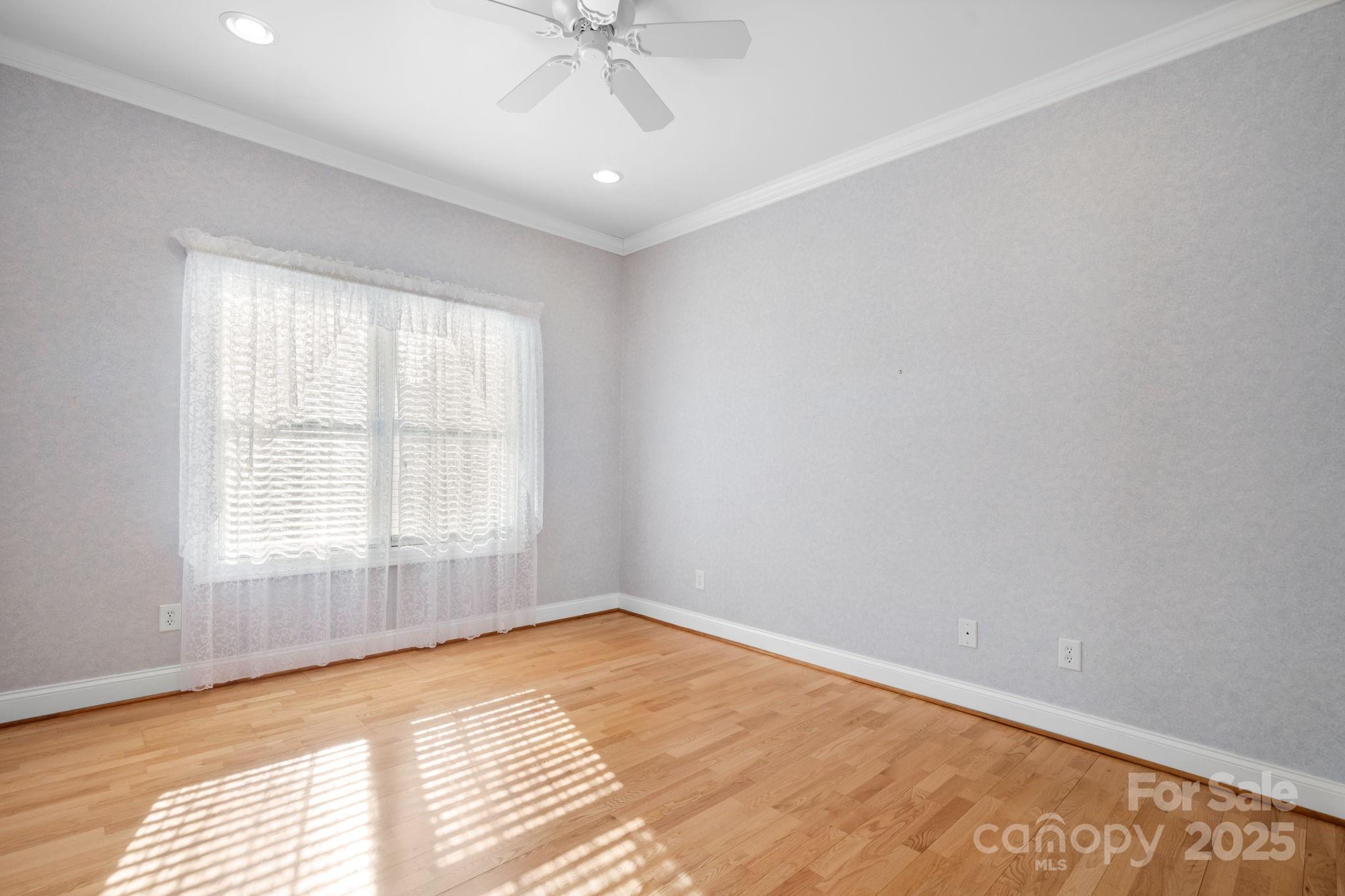 906 3rd St Drive Northeast Conover, NC 28613 - Photo 18 of 47 wooden floor in an empty room with a window
