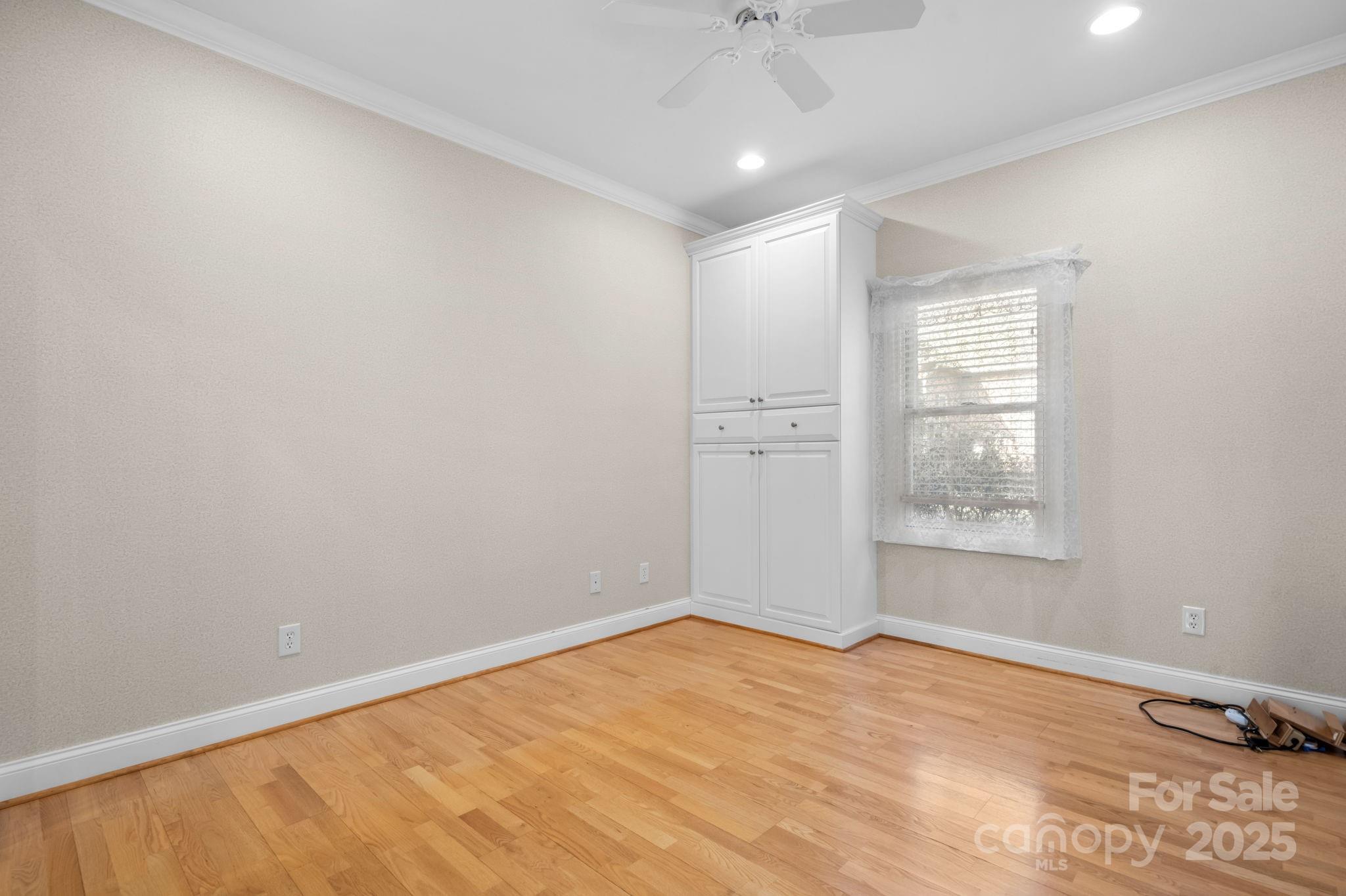 906 3rd St Drive Northeast Conover, NC 28613 - Photo 20 of 47 an empty room with chandelier fan and windows