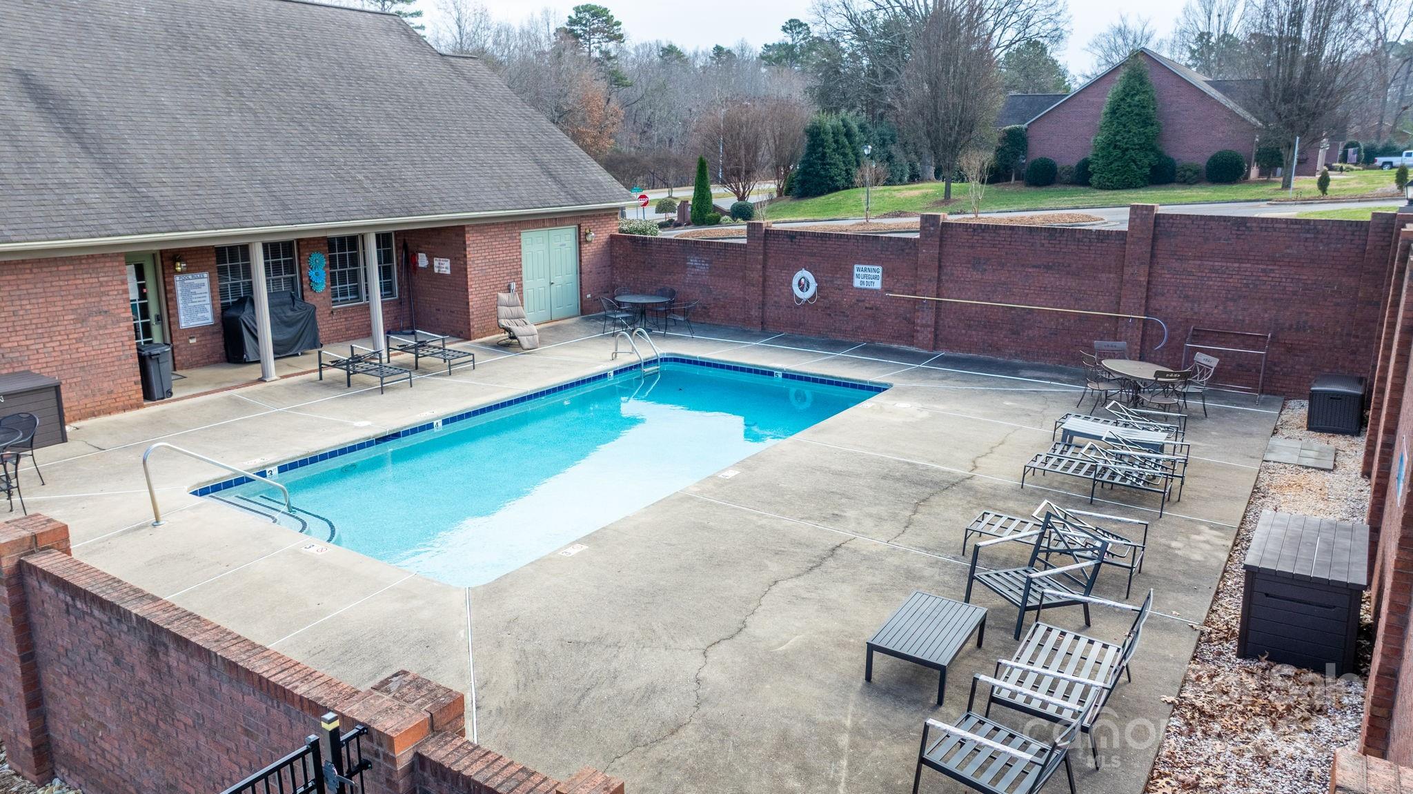 906 3rd St Drive Northeast Conover, NC 28613 - Photo 39 of 47 a view of a house with pool and chairs