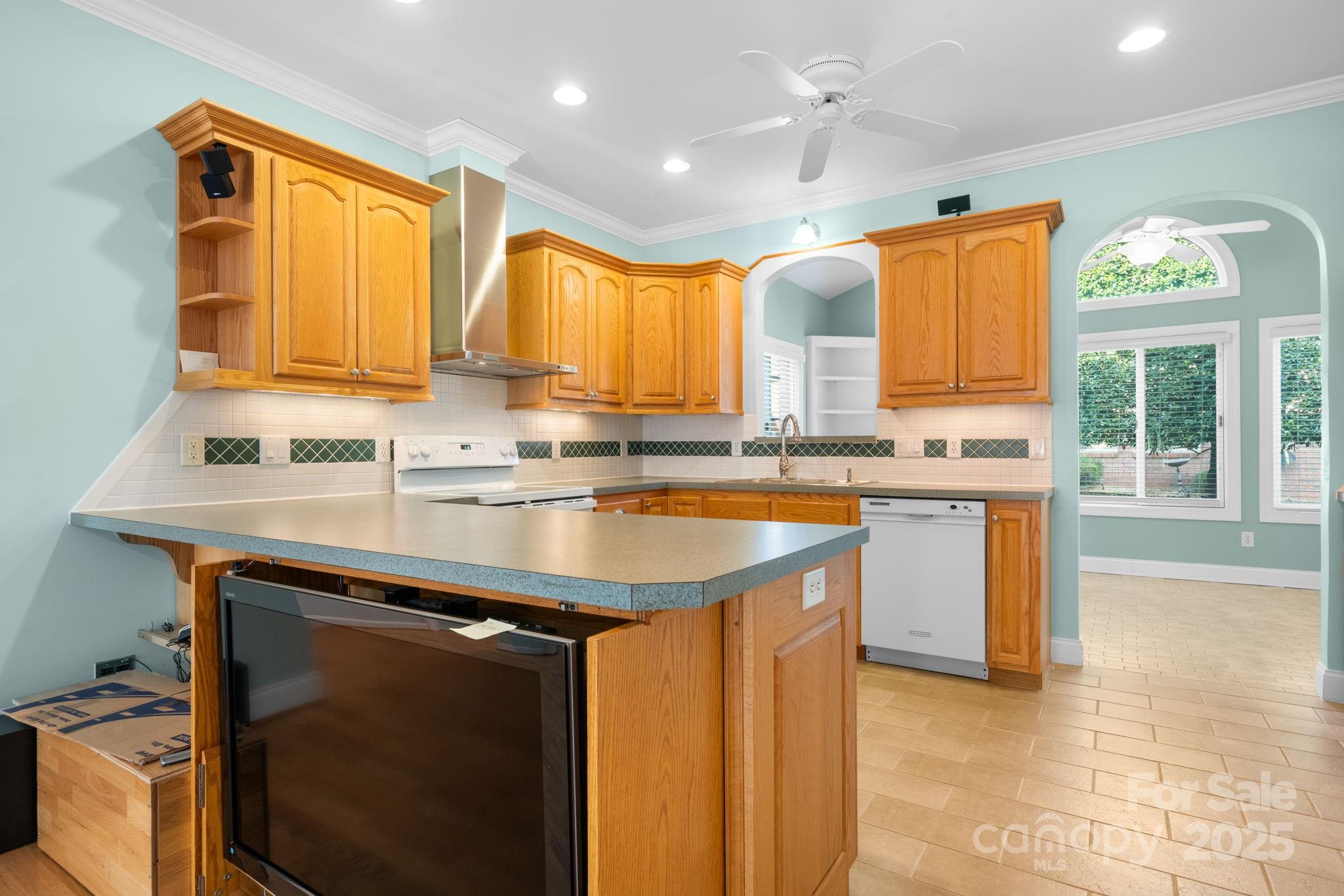 906 3rd St Drive Northeast Conover, NC 28613 - Photo 7 of 47 a kitchen with stainless steel appliances granite countertop a sink a stove and a refrigerator