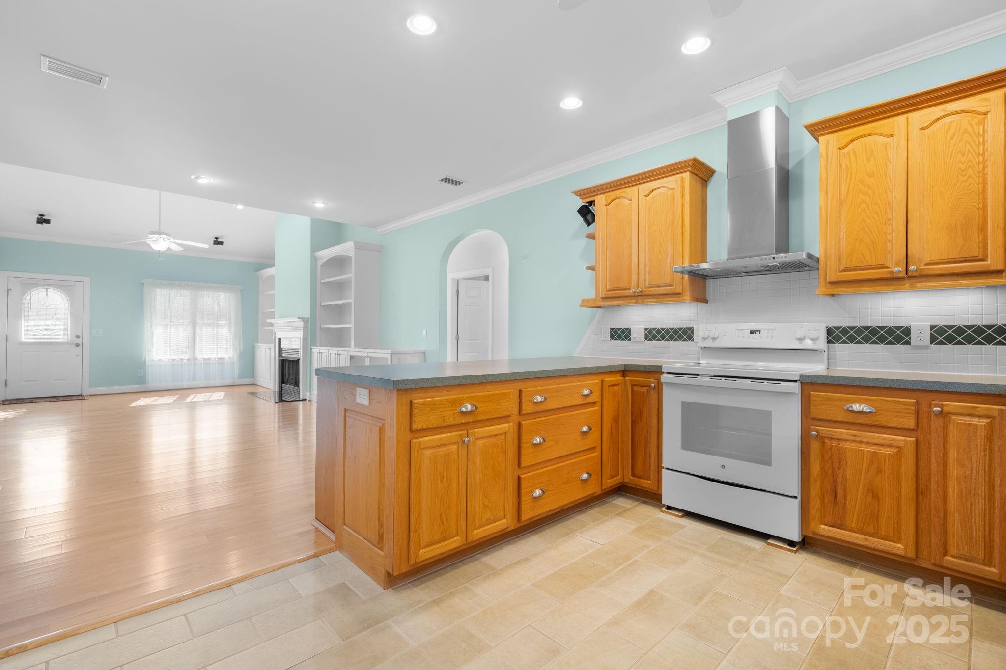 906 3rd St Drive Northeast Conover, NC 28613 - Photo 9 of 47 a kitchen with stainless steel appliances granite countertop a stove a sink and a granite counter tops with a large window