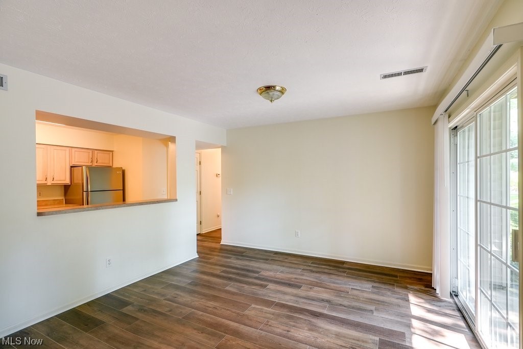 995 Canyon View Road, Unit B Northfield, OH 44067 - Photo 8 of 23 Dedicated dining room sits adjacent to the living room and kitchen.