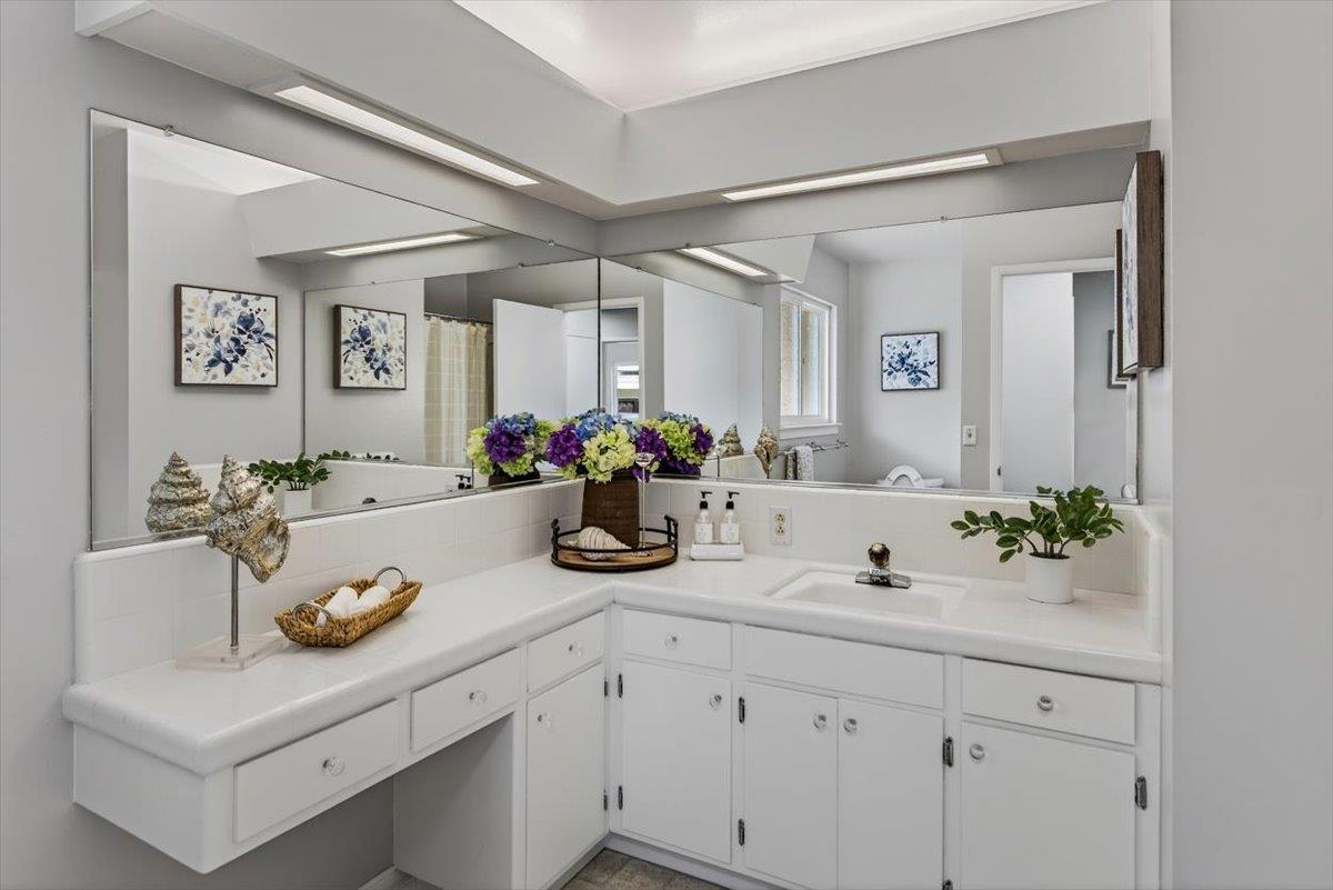 251 Old Adobe Road Los Gatos, CA 95032 - Photo 27 of 40 a bathroom with a sink double vanity and mirror