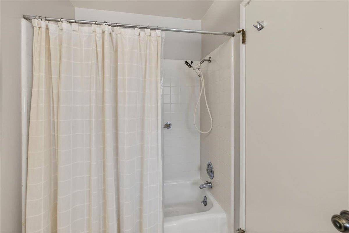 251 Old Adobe Road Los Gatos, CA 95032 - Photo 28 of 40 a bathroom with a shower and a bath tub