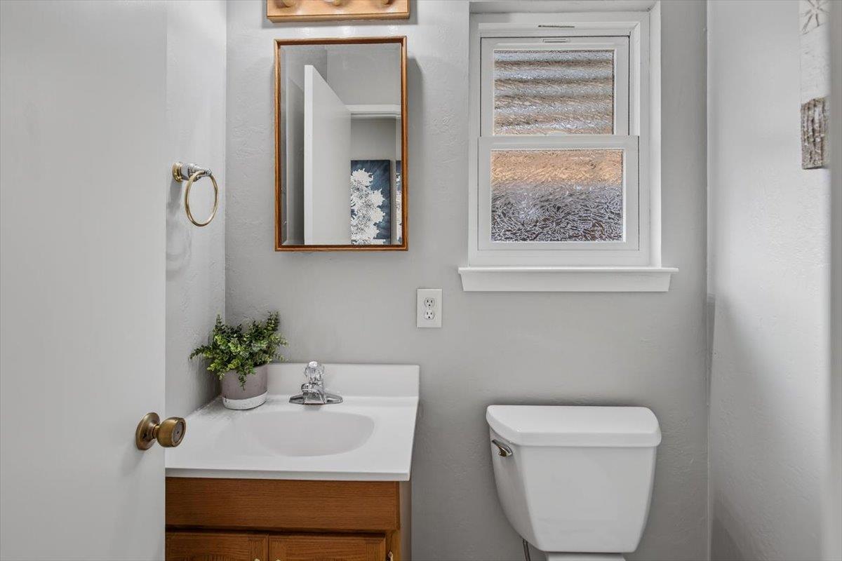 251 Old Adobe Road Los Gatos, CA 95032 - Photo 30 of 40 a bathroom with a toilet a sink and a window