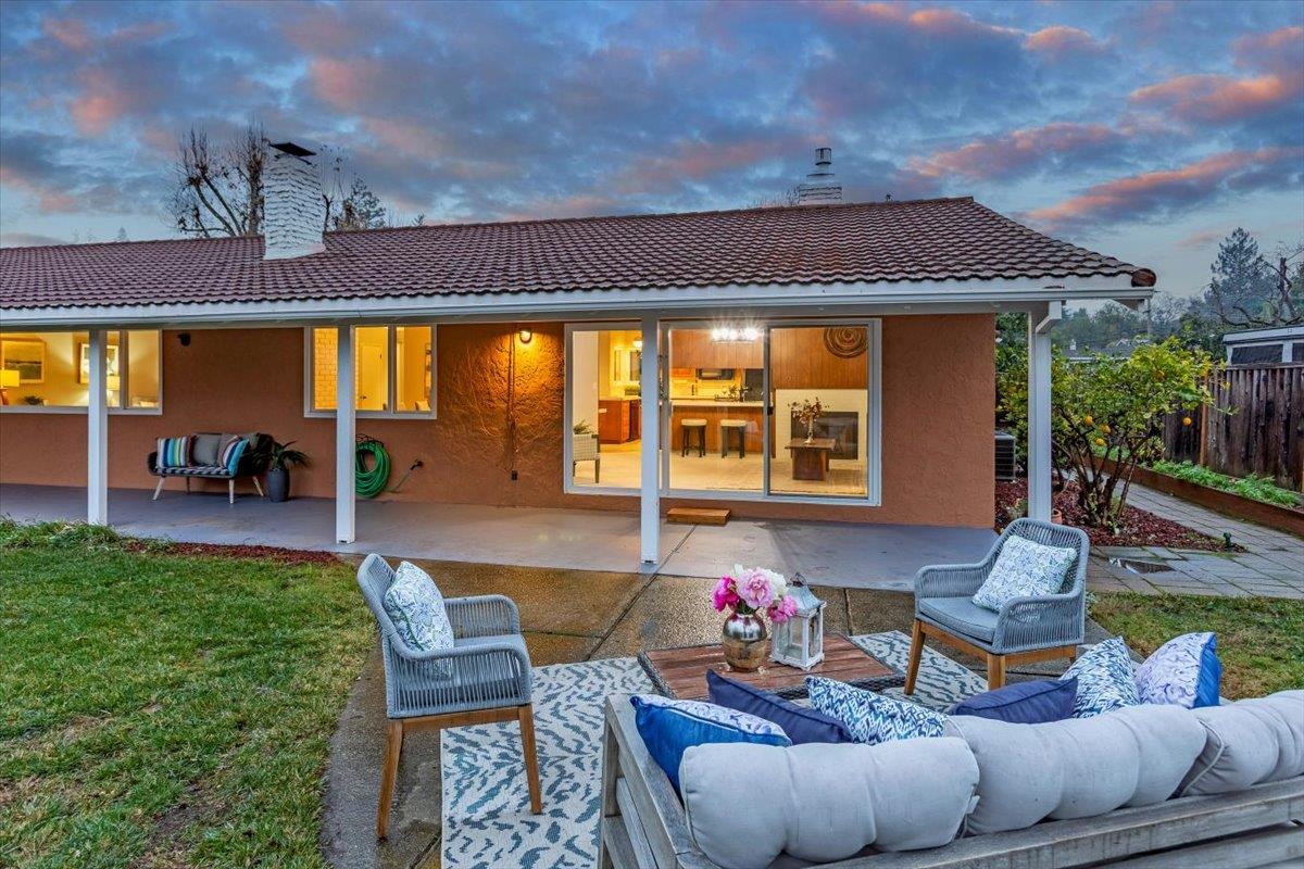 251 Old Adobe Road Los Gatos, CA 95032 - Photo 35 of 40 a view of a patio with couches table and chairs and potted plants