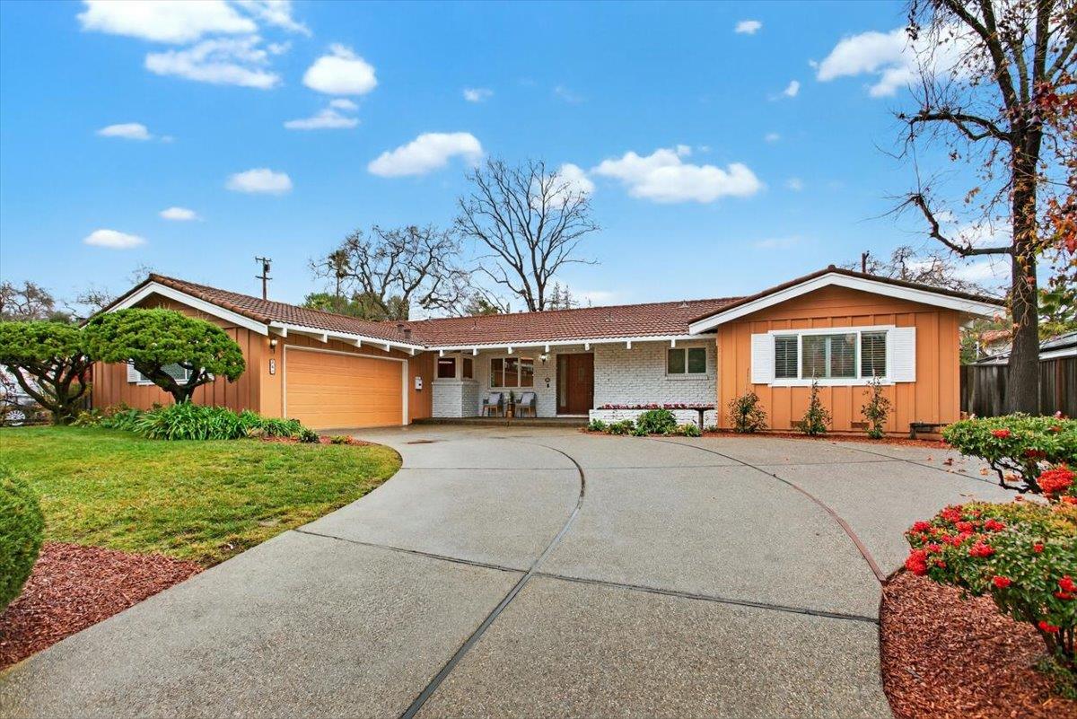 251 Old Adobe Road Los Gatos, CA 95032 - Photo 6 of 40 a front view of a house with a yard and garage