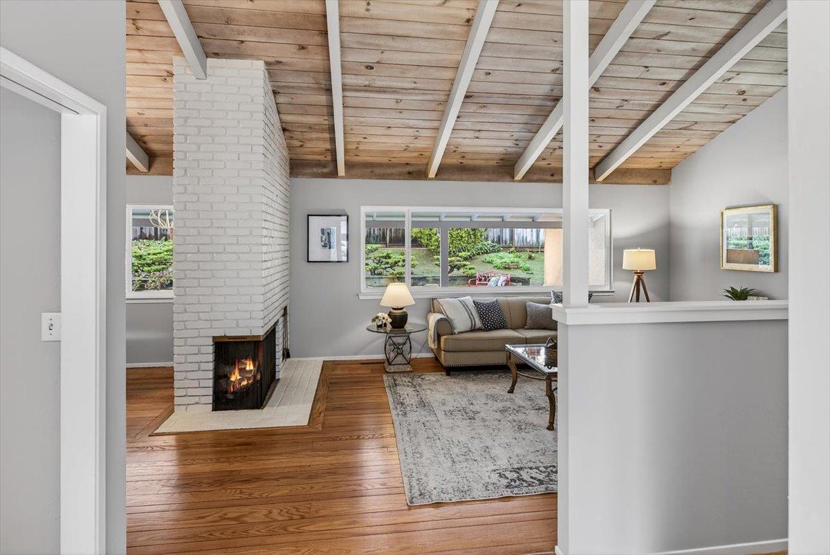 251 Old Adobe Road Los Gatos, CA 95032 - Photo 10 of 40 a living room with furniture and a fireplace