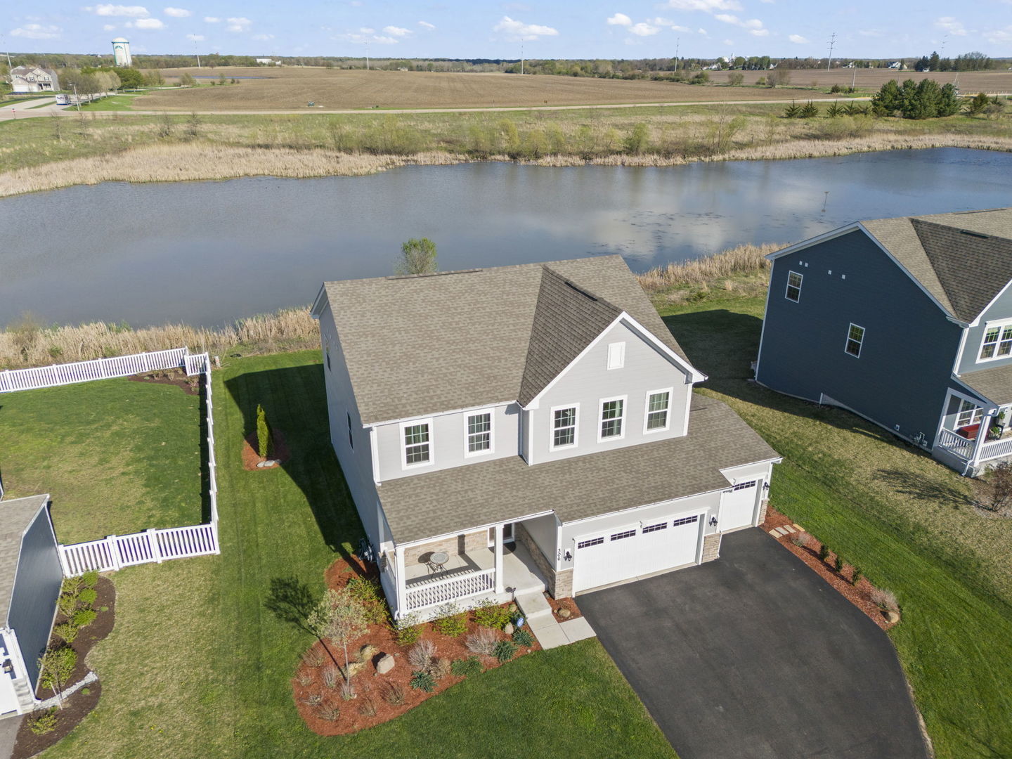 306 Atkinson Drive Sugar Grove, IL 60554 - Photo 1 of 50 a aerial view of a house with a lake view