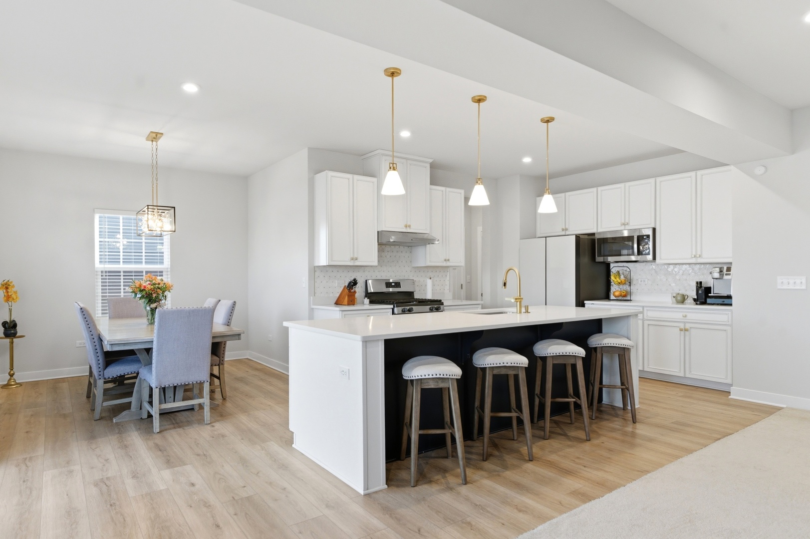 306 Atkinson Drive Sugar Grove, IL 60554 - Photo 16 of 50 a large kitchen with a table and chairs