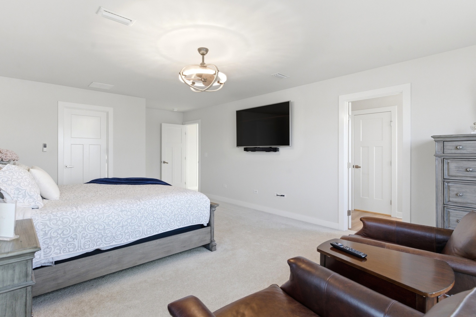 306 Atkinson Drive Sugar Grove, IL 60554 - Photo 22 of 50 a spacious bedroom with a bed and a flat screen tv