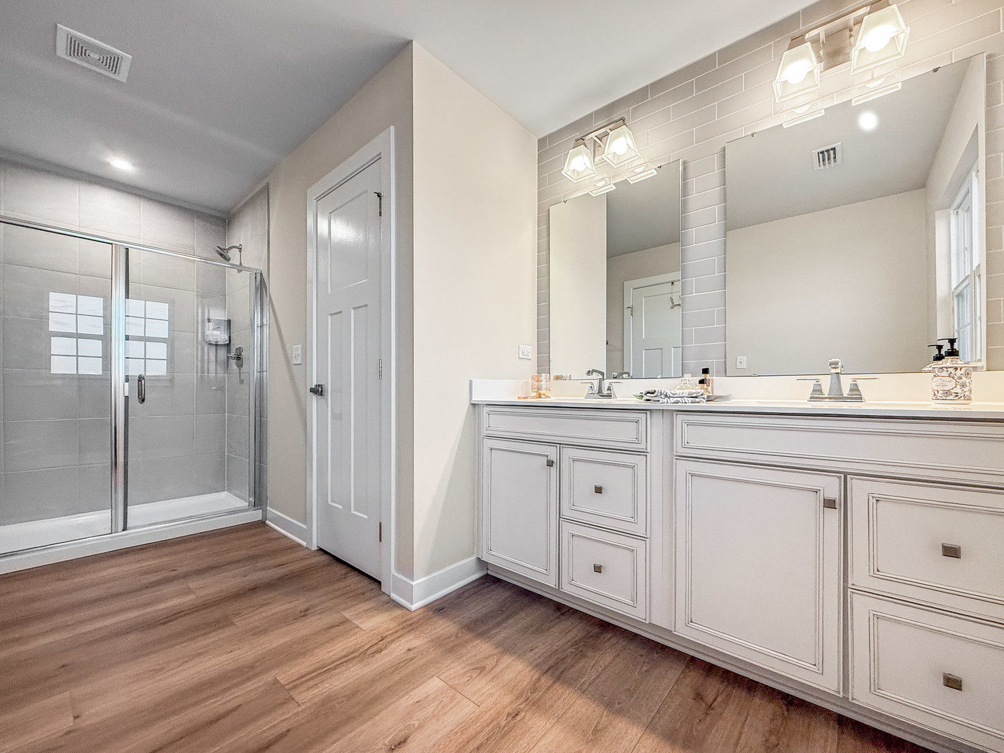 306 Atkinson Drive Sugar Grove, IL 60554 - Photo 23 of 50 a spacious bathroom with double sink large mirror and shower